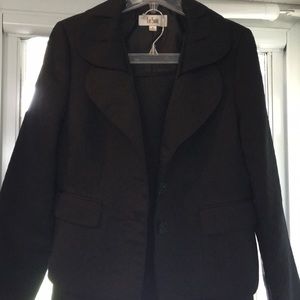 Two piece Black polyester suit .